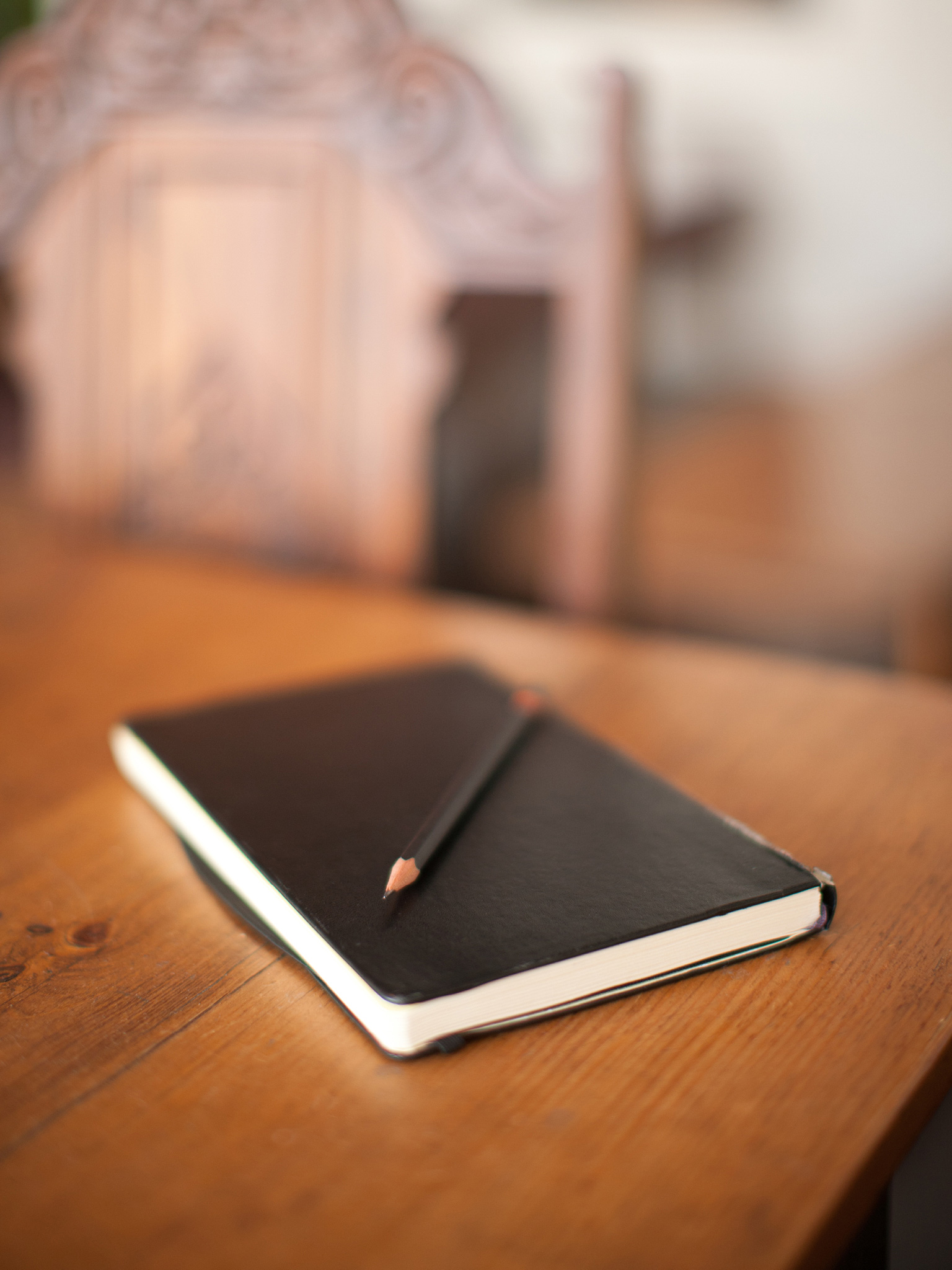 Using focus to highlight subject; bokeh photography example, leather notebook.